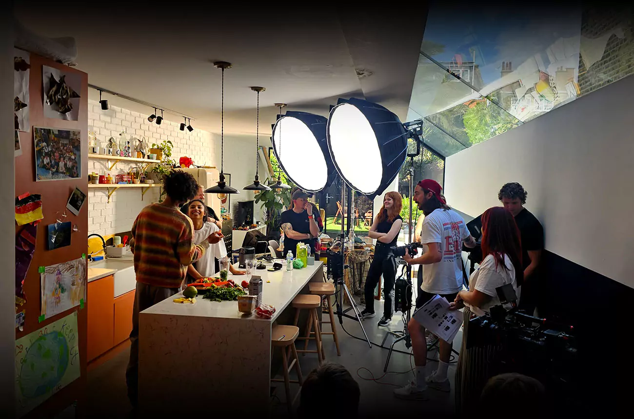 GNG Studios team on location during a commercial shoot for PureGym, filming a lifestyle scene in a kitchen set with professional lighting and crew.