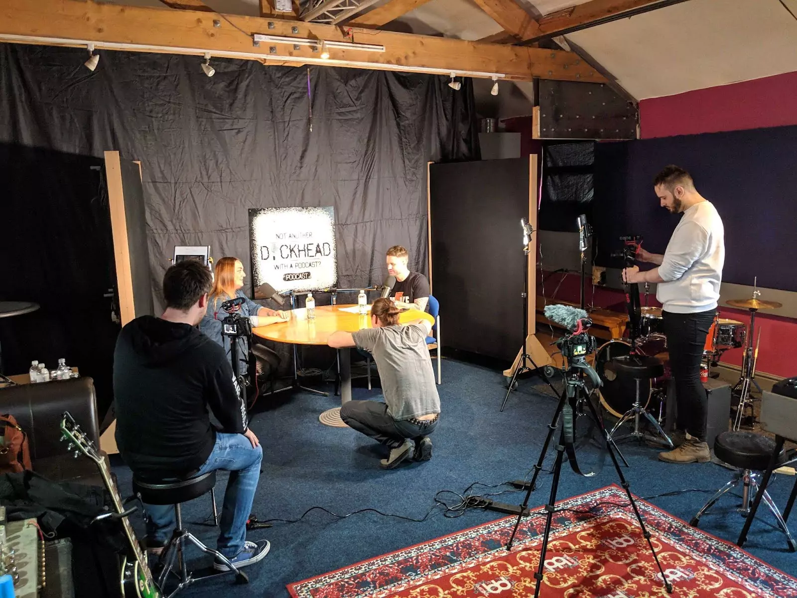 Behind-the-scenes shot of Jenny Radcliffe recording an episode of Mike Winnet’s podcast, with the GNG Studios crew filming on set at a roundtable setup under studio lights.