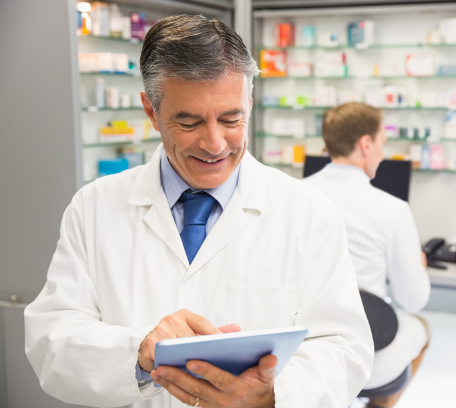 Pharmacist handing medication to customer. Retail pharmacy, pharmacy integration, food as medicine