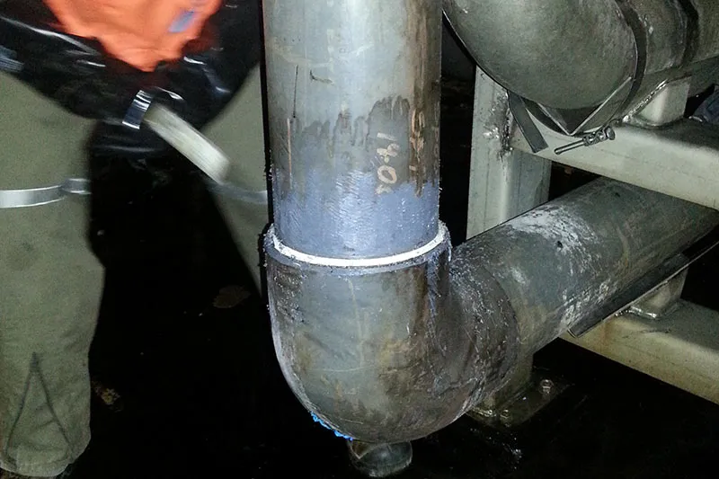 Leaking pipeline in mine ready for wrapping