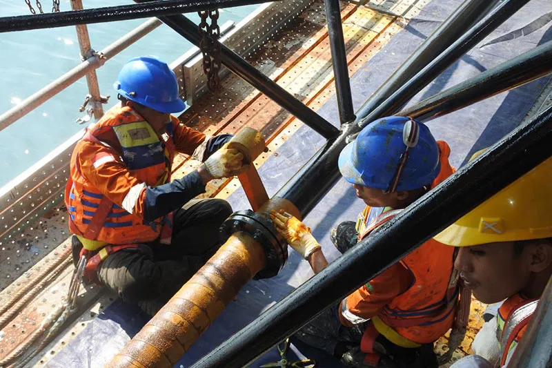 Pipewrap Petrolatum tape being applied to offshore structure