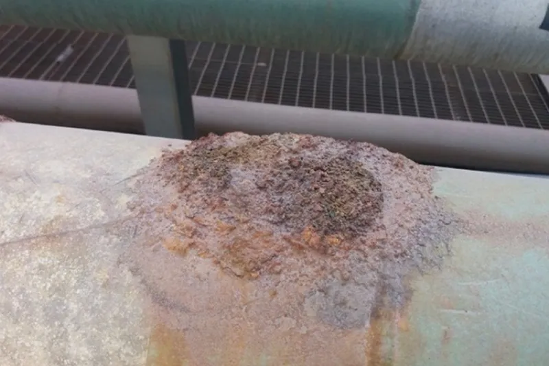 Heavily pitted and corroded pipeline awaiting UPS surface preparation and wrapping