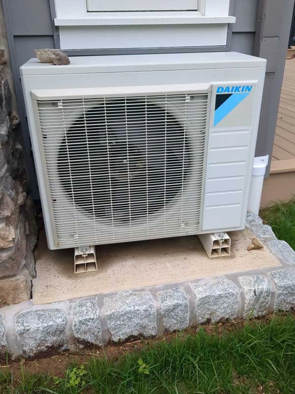 Residential air conditioning unit in Yardley, PA undergoing diagnostics during emergency summer repair.