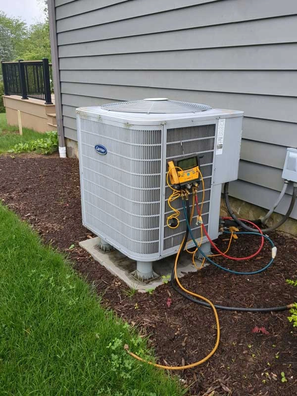 Technician's gauge setup during AC repair in Yardley, PA to diagnose energy efficiency issues.