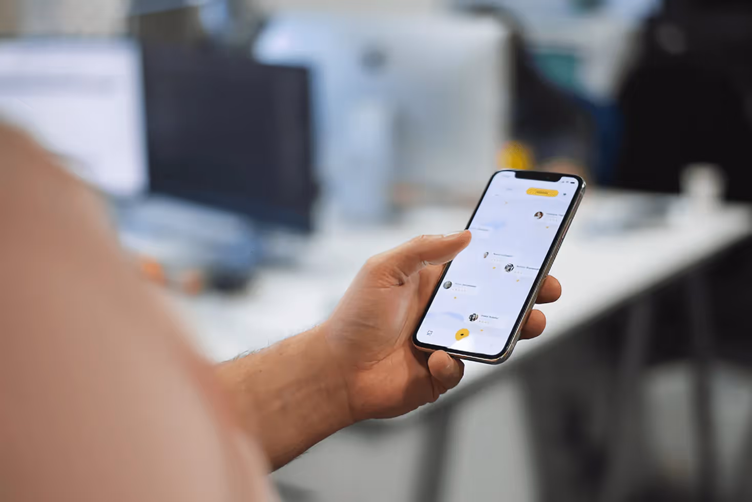 A person using a smartphone, navigating through a mobile app, illustrating the ease and engagement of app-based interactions