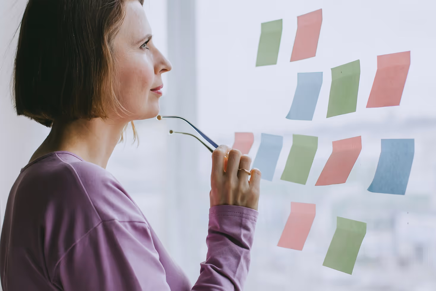 Woman looking at notes making a choice
