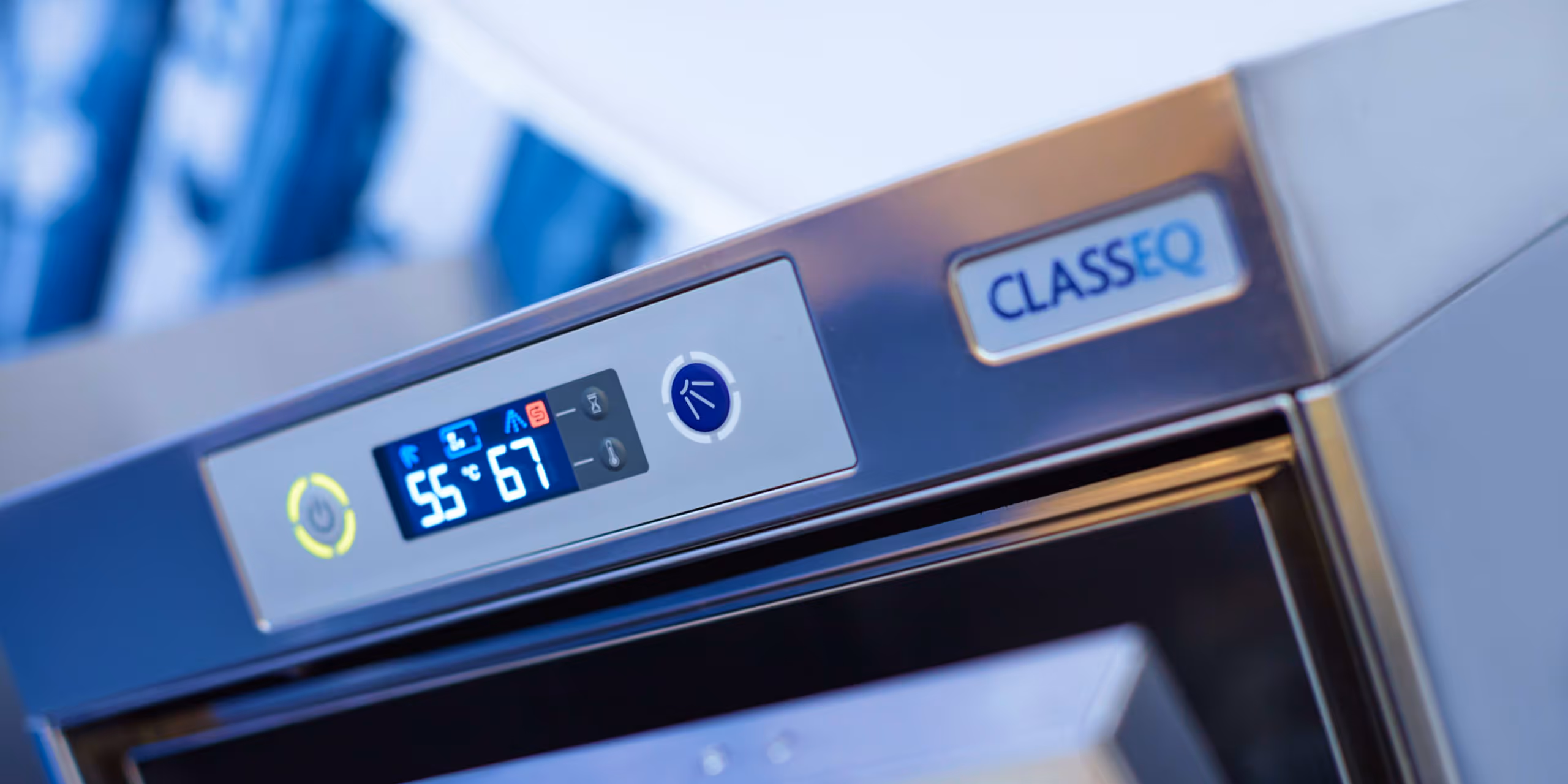 Close-up of the digital control panel on a Classeq commercial dishwasher showing temperature and operating icons.