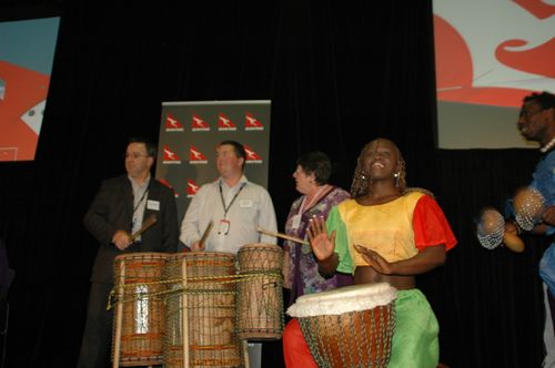 Young children joyfully dancing in colorful African print outfits, smiling and following the beat of live drumming in the background. The moment captures cultural pride and youthful spirit. #AfricanYouth #CulturalRoots #JoyInMotion #KidsInCulture #AfrobeatsVibes