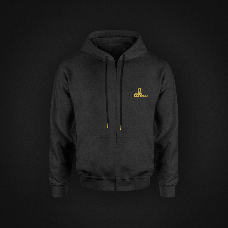 Alpha Honey branded sweater—cozy fleece with embroidered logo and honeycomb details, designed as premium merch to extend the brand.