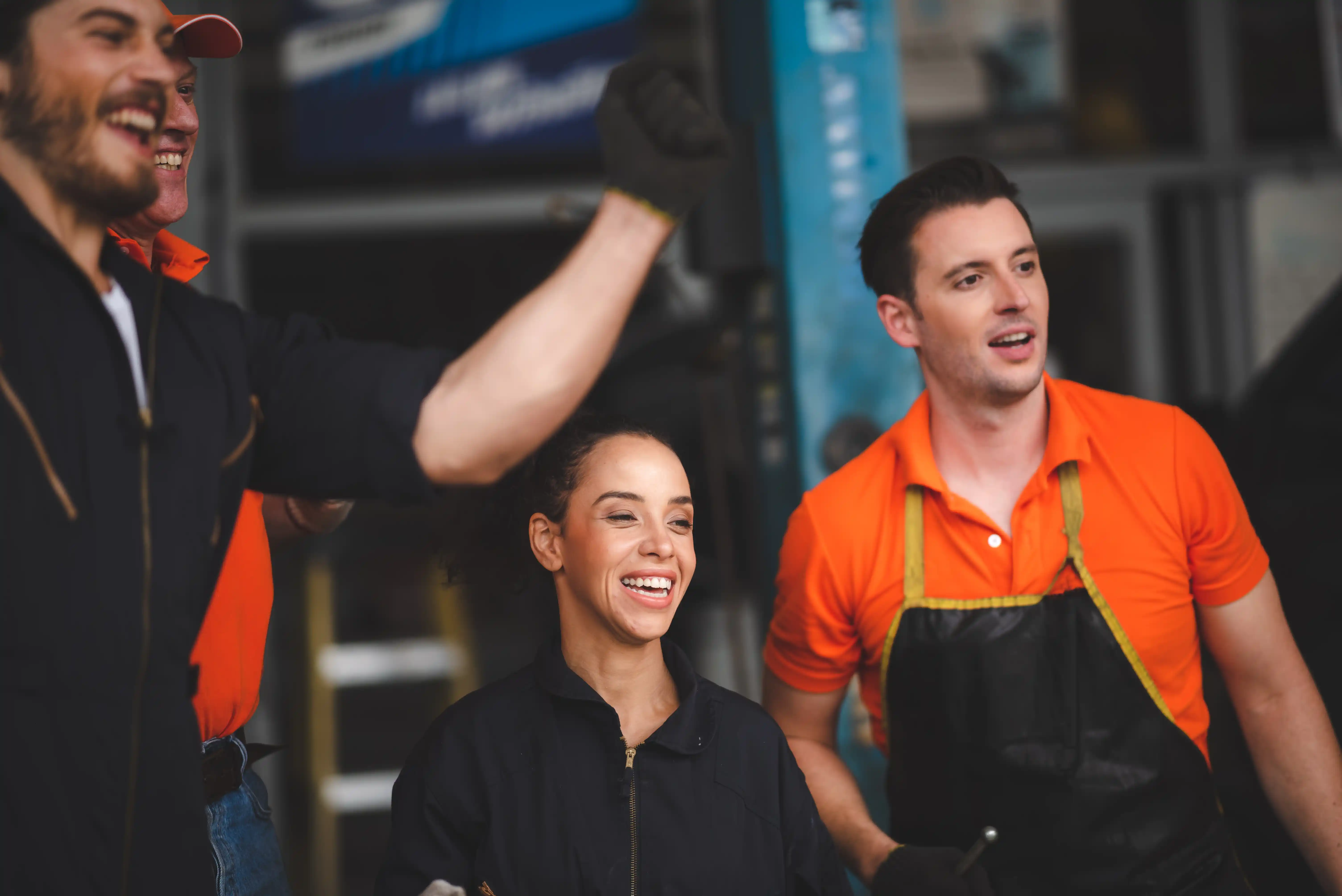 coworkers laughing and smiling in warehouse