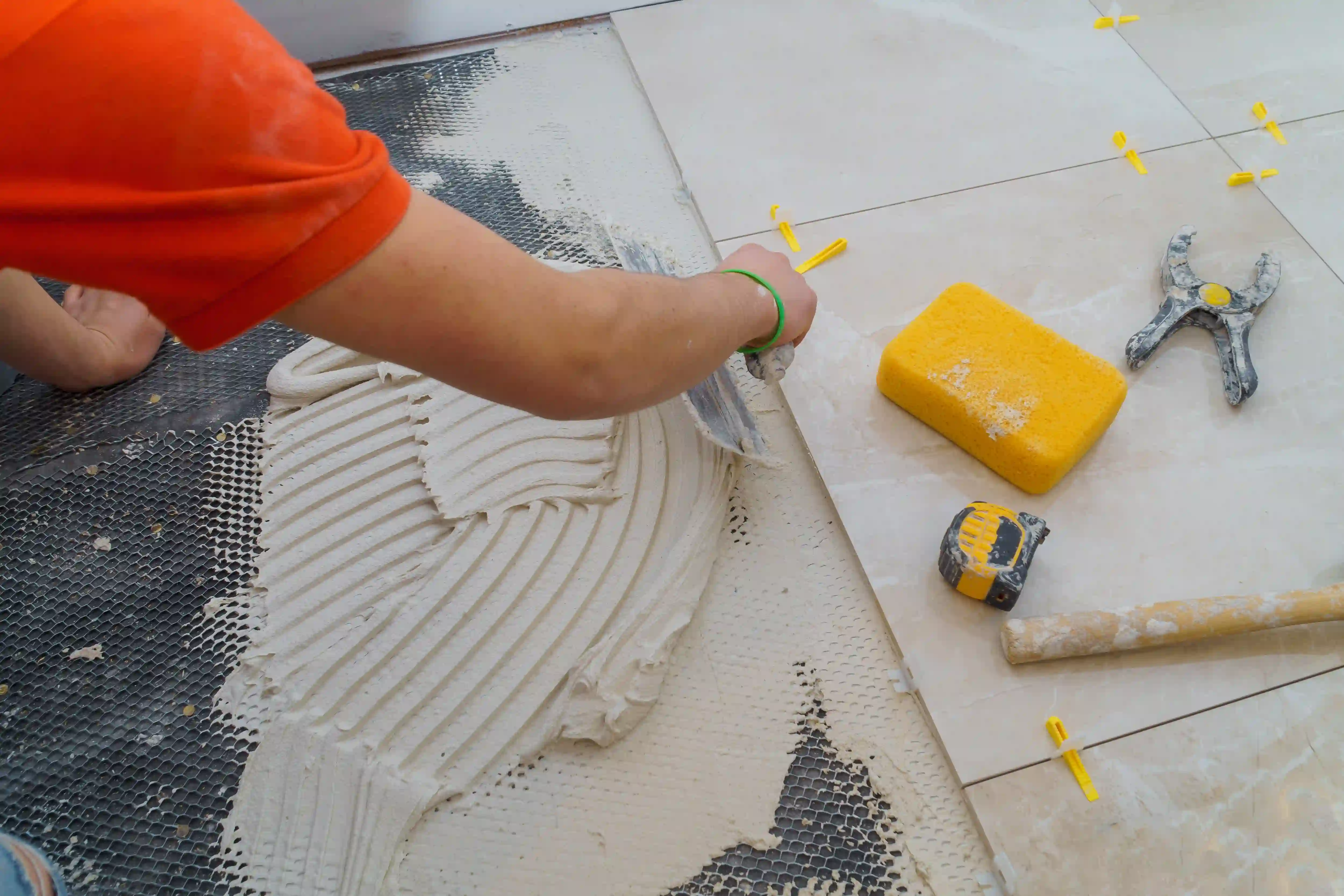 applying grout to tiles