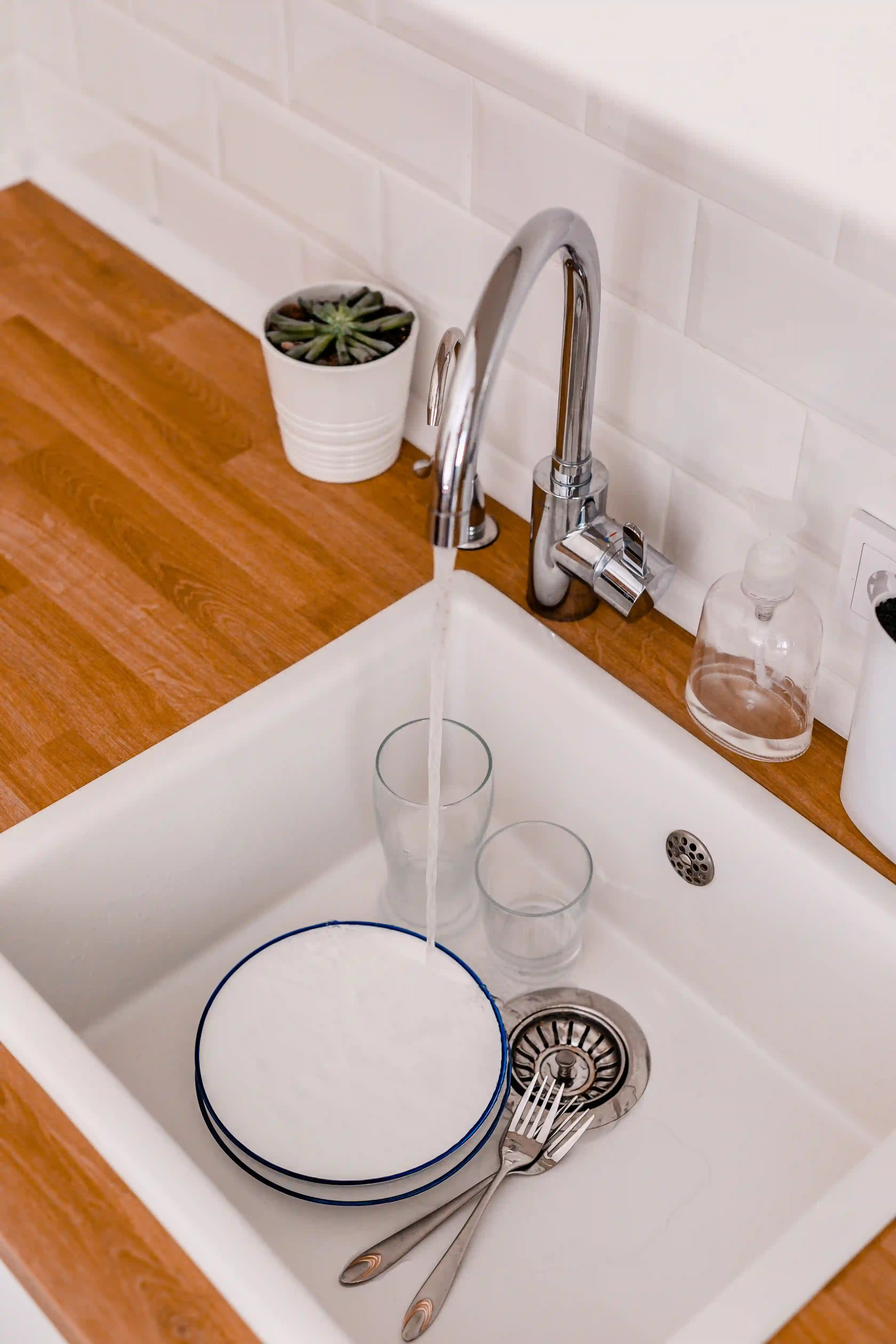 white kitchen sink in wooden counter