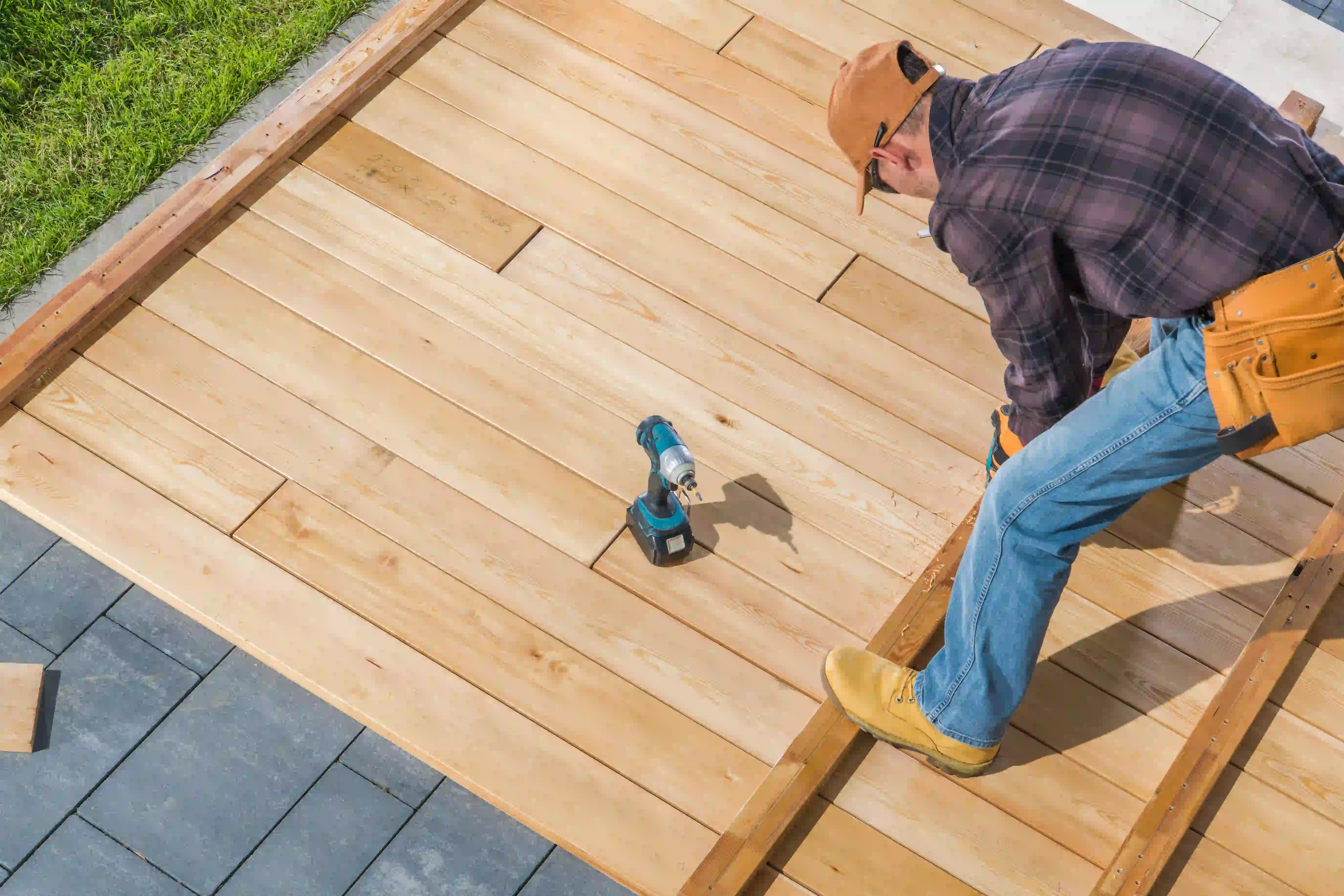 man building patio outside