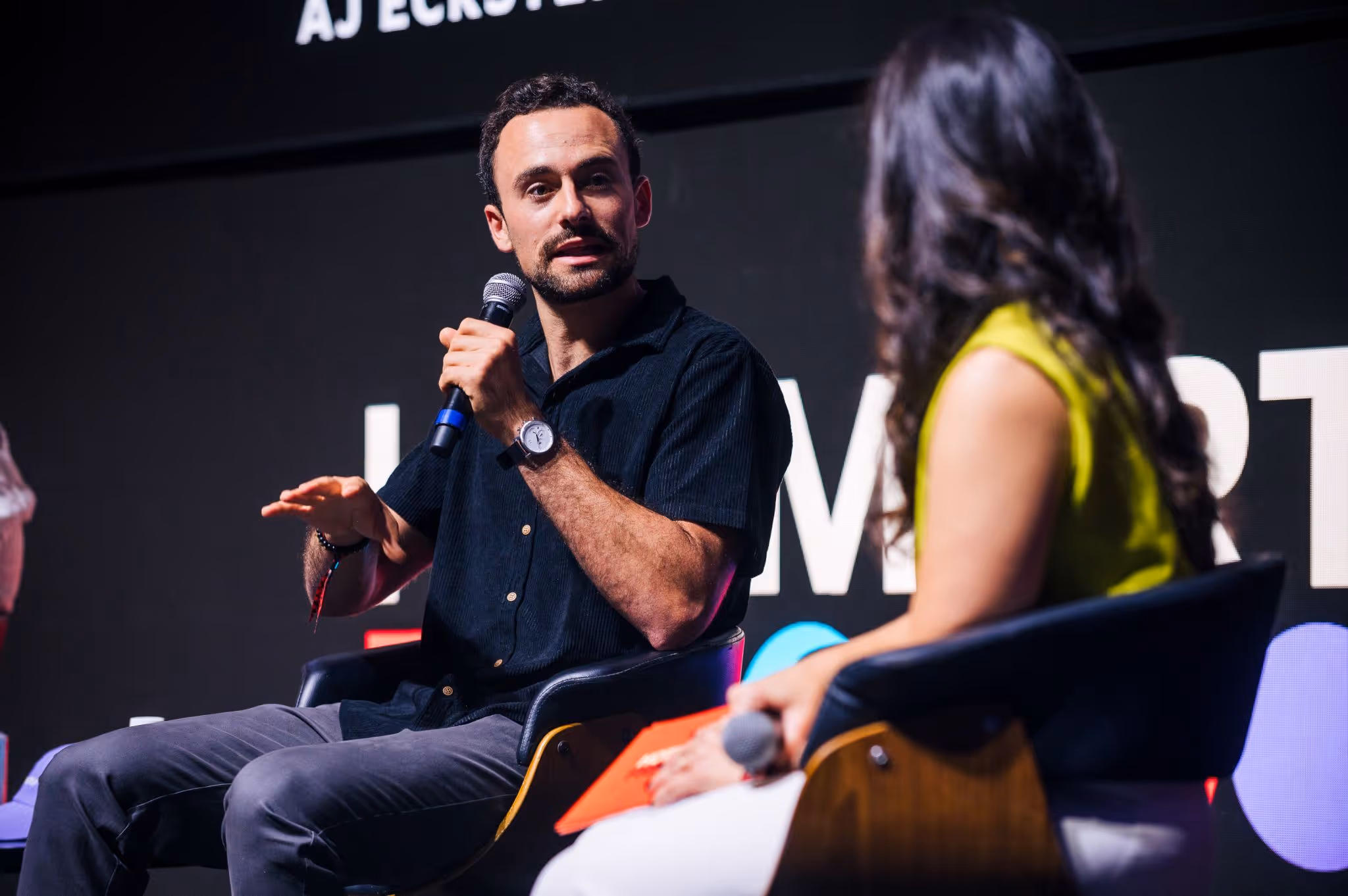 AJ Eckstein Speaking at hotmart 2025 event