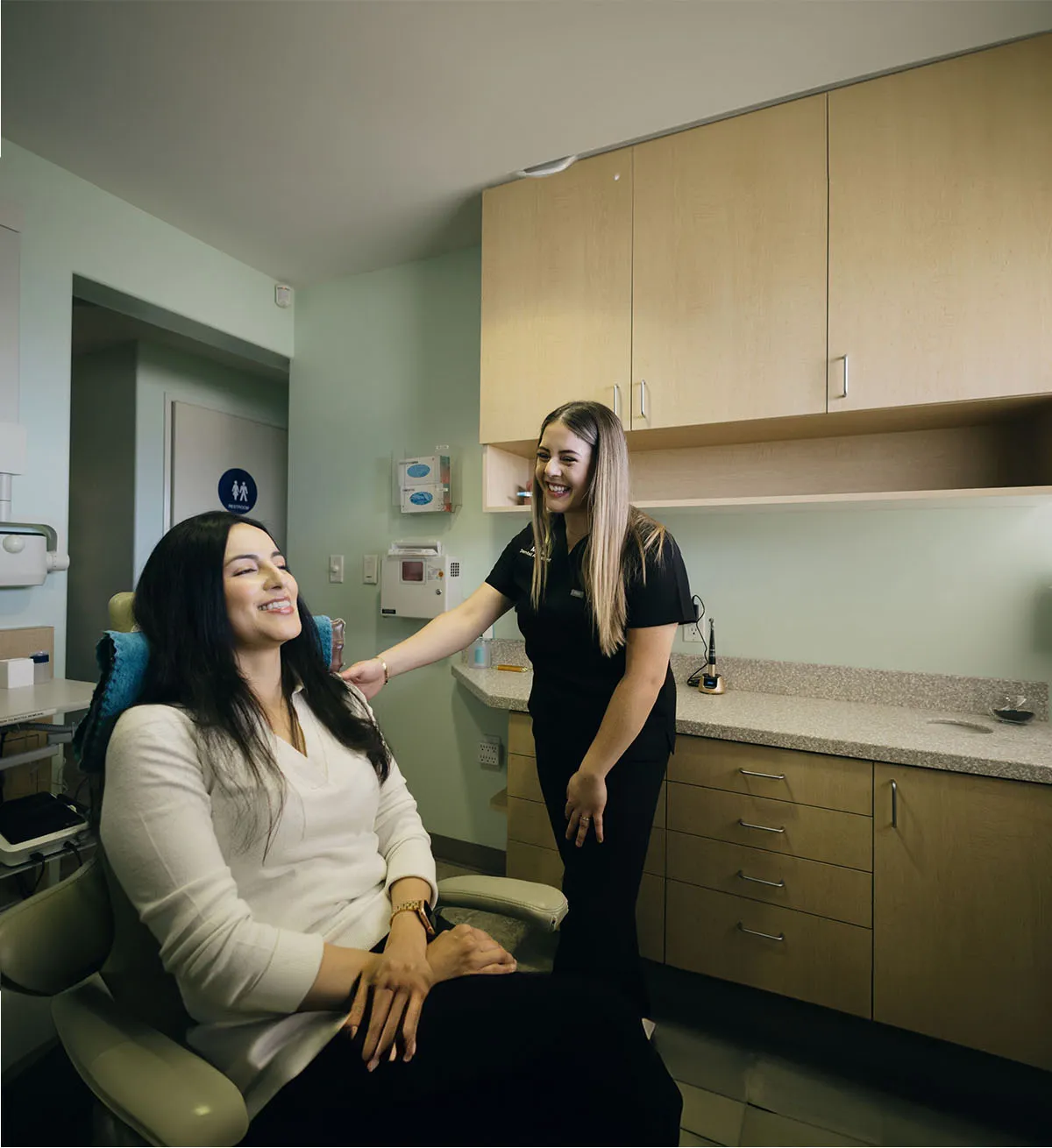 A patient and team member together in a treatment room at Serene Dentistry in Ventura, CA