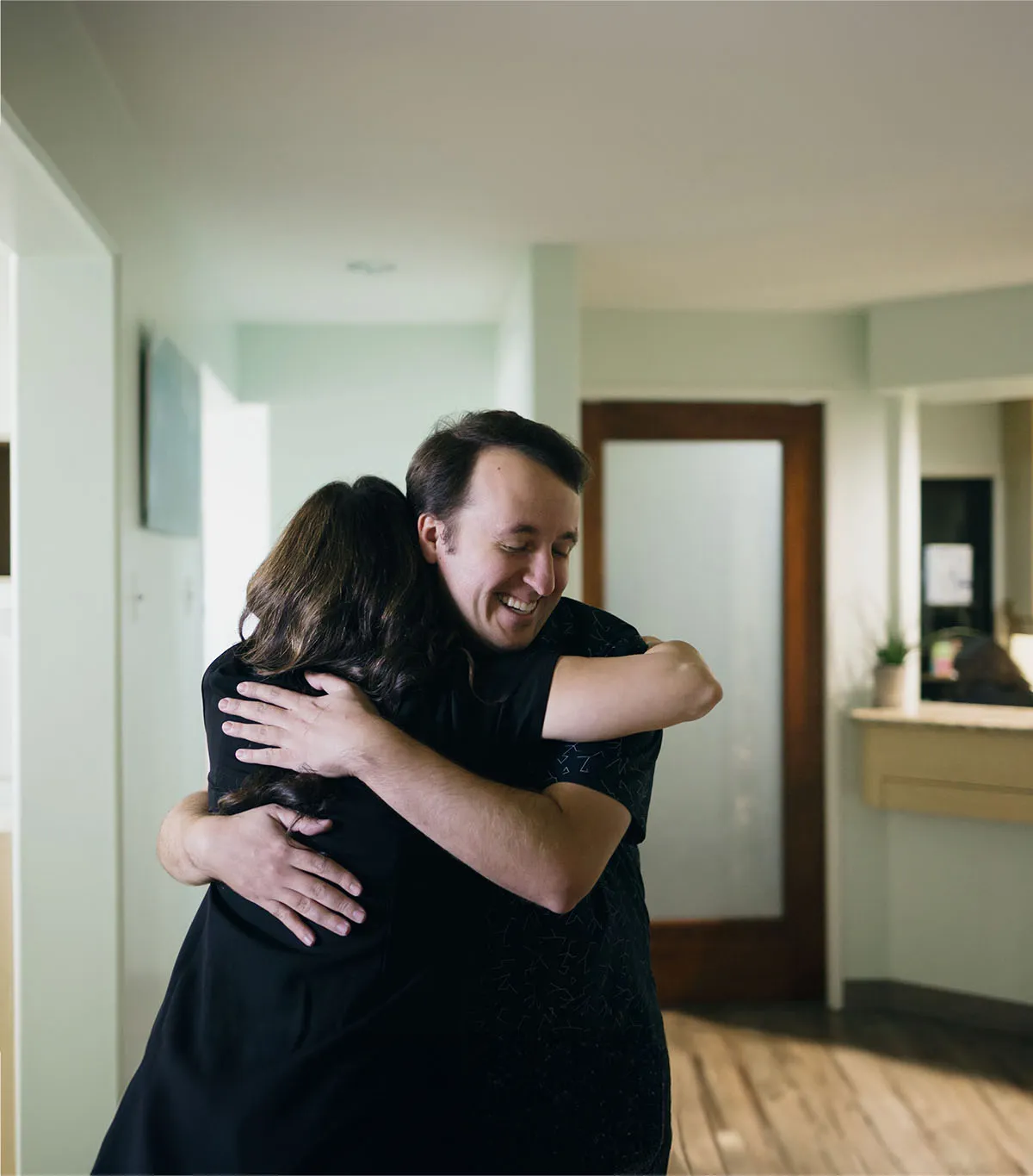 A patient and team member embracing at Serene Dentistry in Ventura, CA