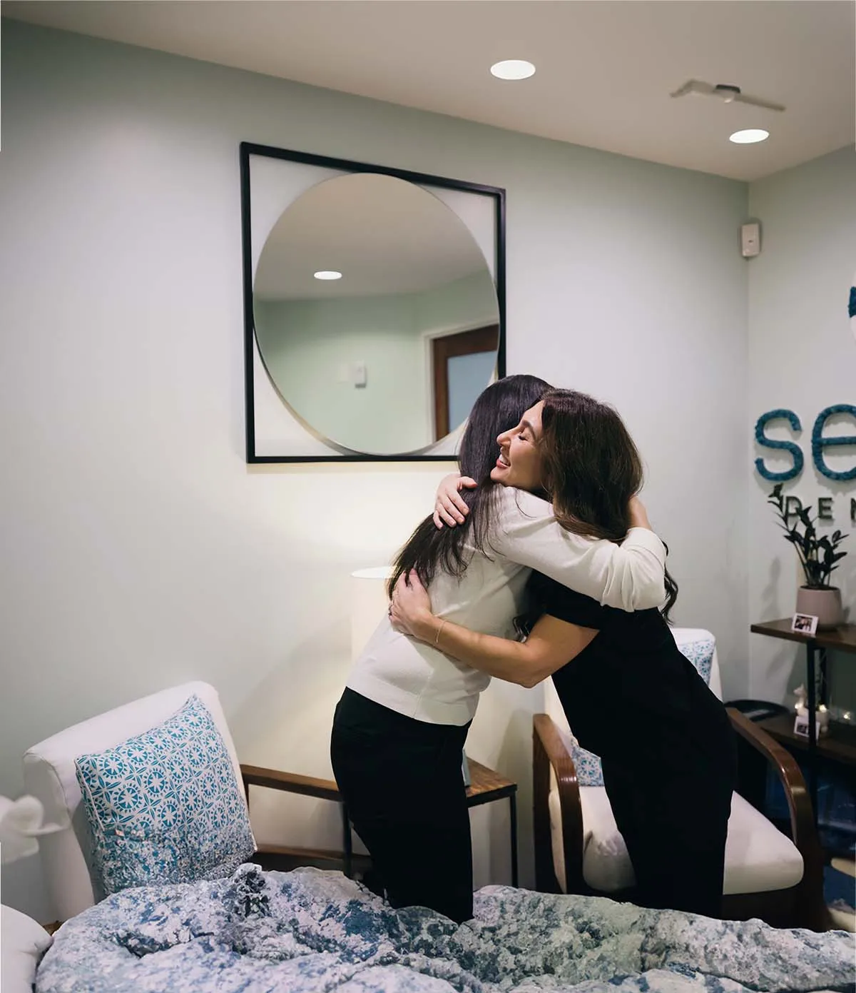 A patient and team member sharing a warm hug at Serene Dentistry in Ventura, CA