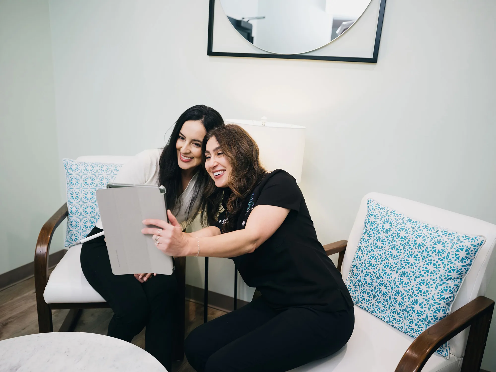 A Serene Dentistry team member reviewing information with a patient in Ventura, CA