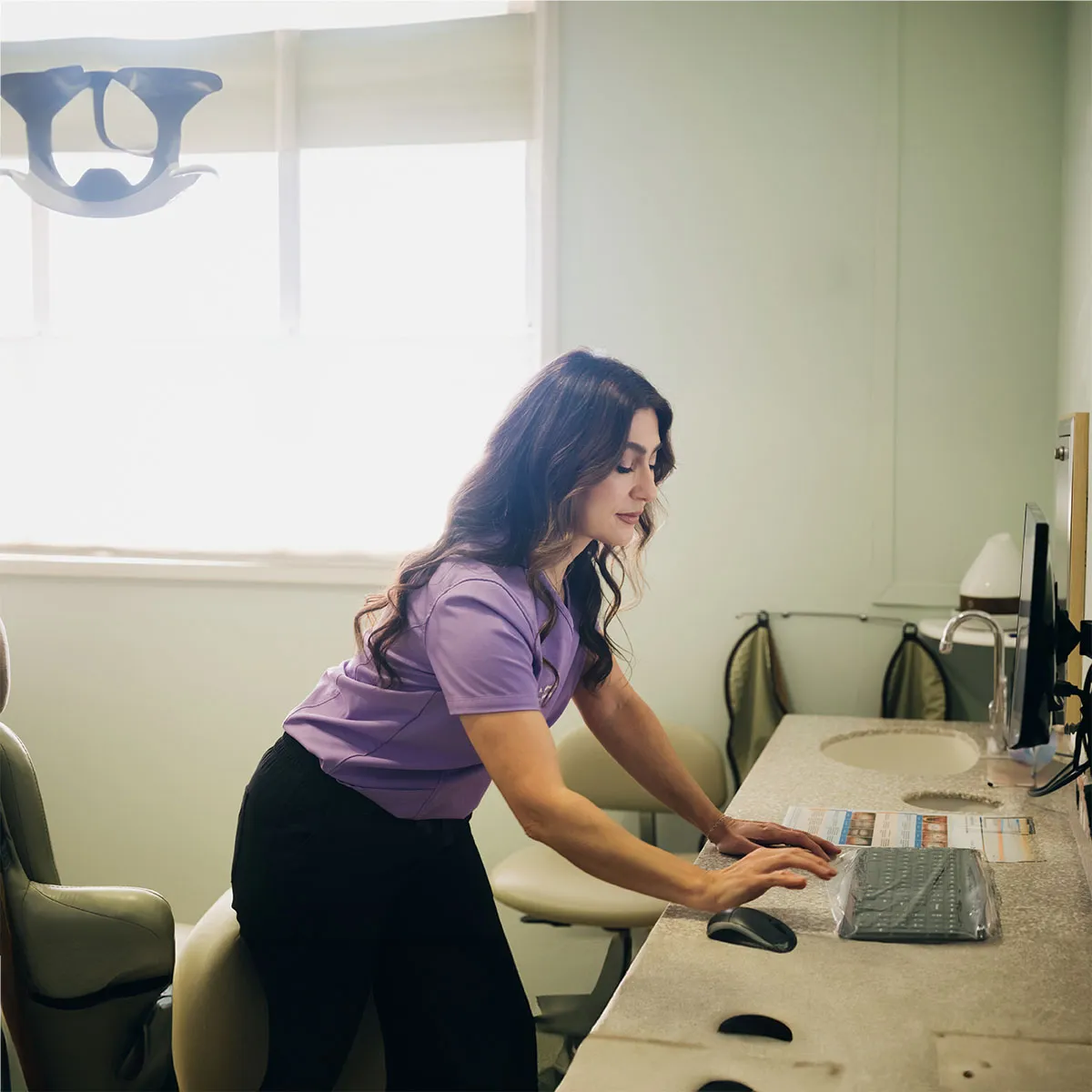A Serene Dentistry team member at the front desk in Ventura, CA