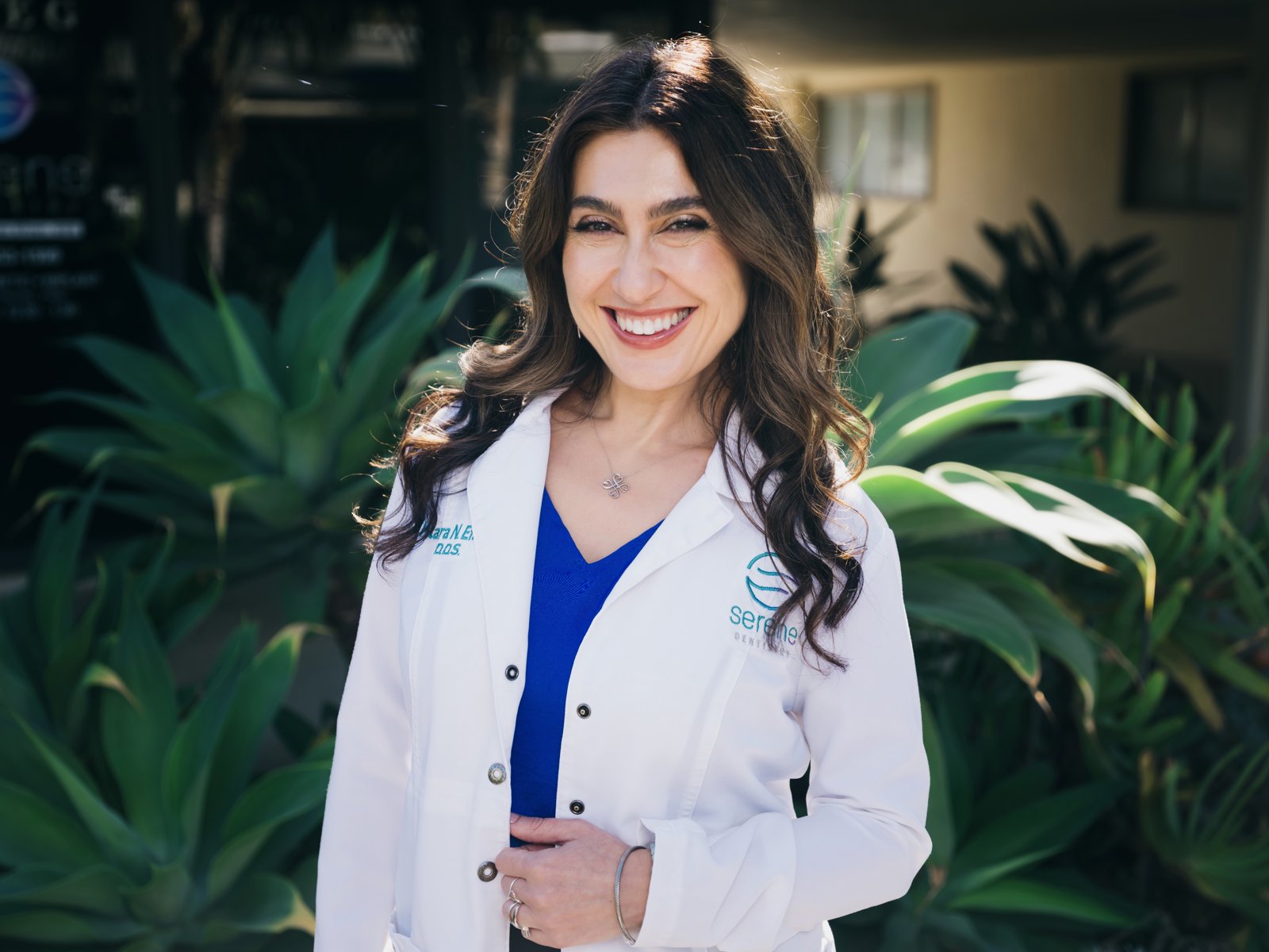 Dr. Klara Efner in her white coat outside Serene Dentistry