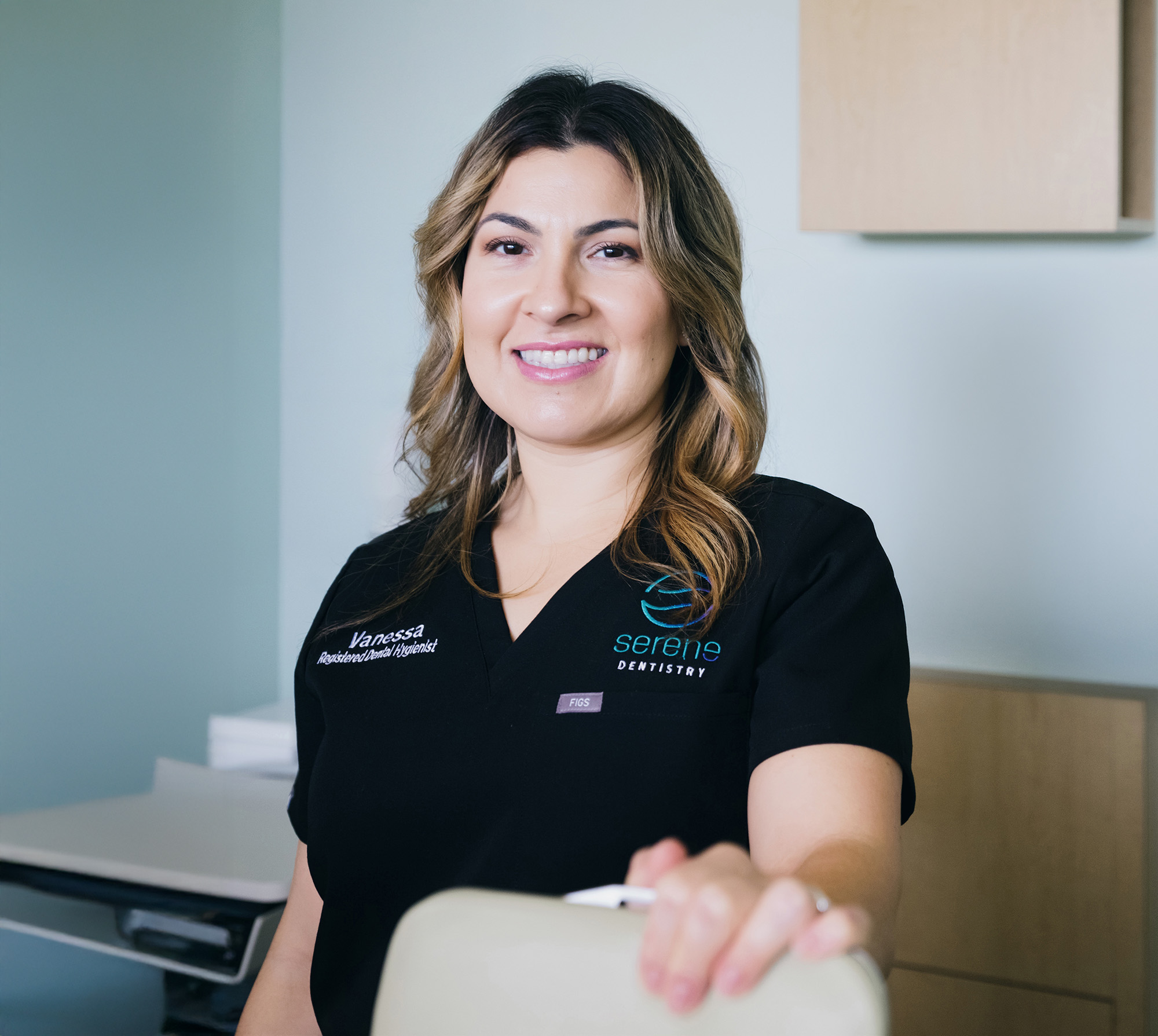 A Serene Dentistry hygienist in a treatment room at the Ventura office