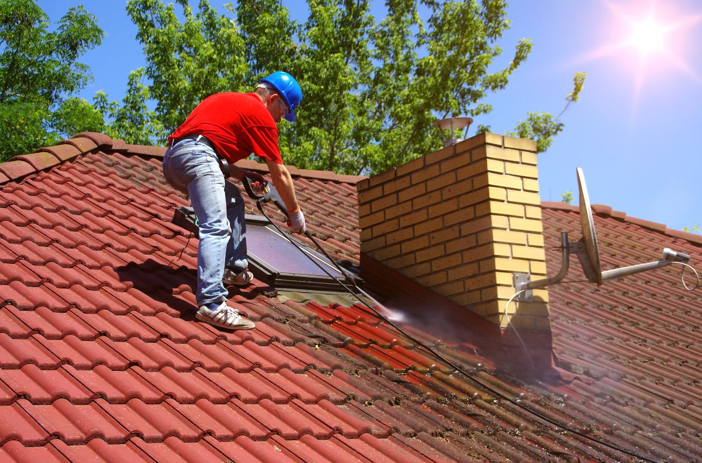 A Marvel Window Washing expert conducting roof cleaning in Santa Monica, CA, demonstrating top-tier quality and professional service. Roof Cleaning near me.