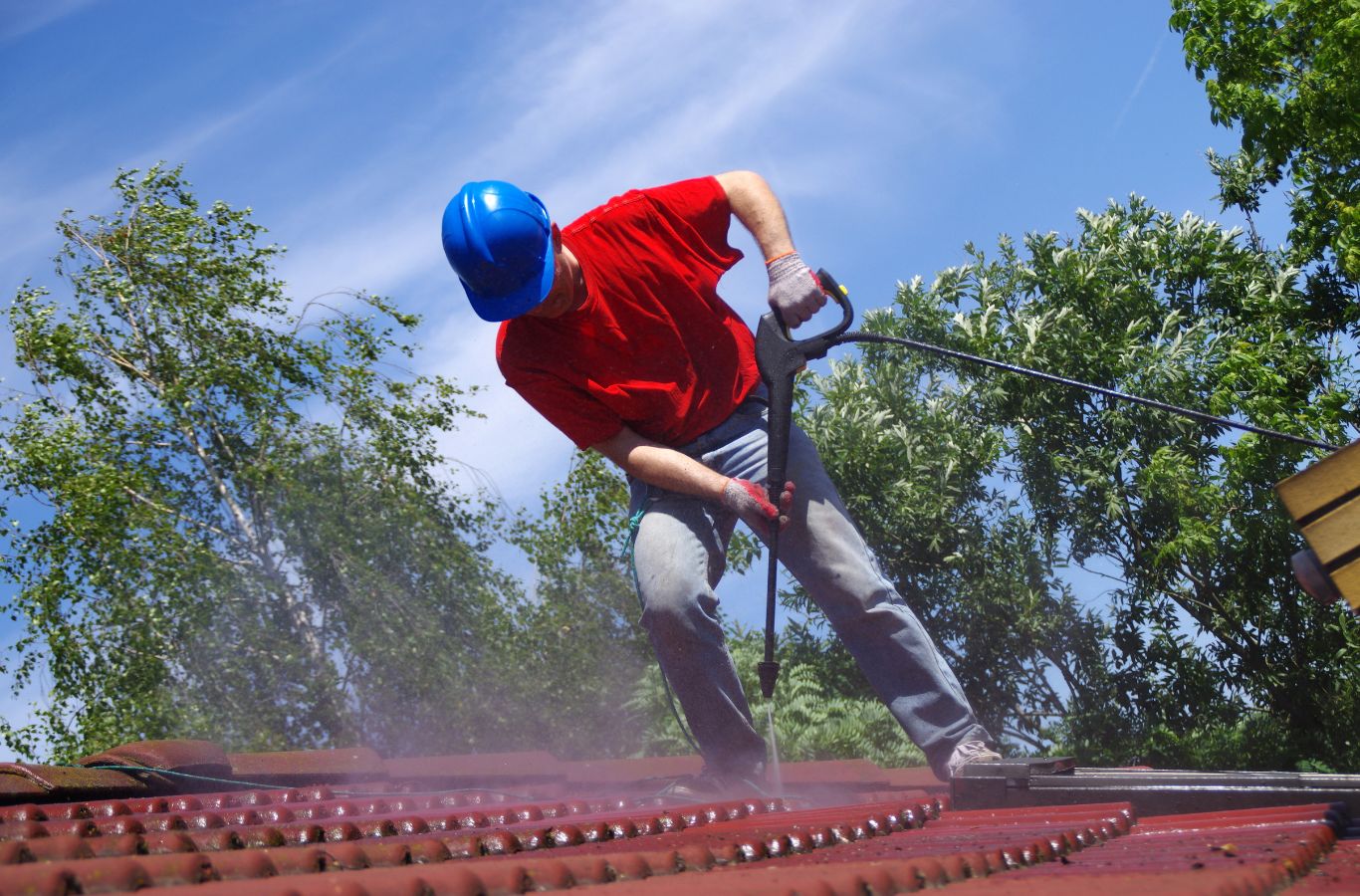 A Marvel Window Washing specialist executing roof cleaning in Beverly Hills, CA, demonstrating what makes our service stand out. Roof Cleaning near me.