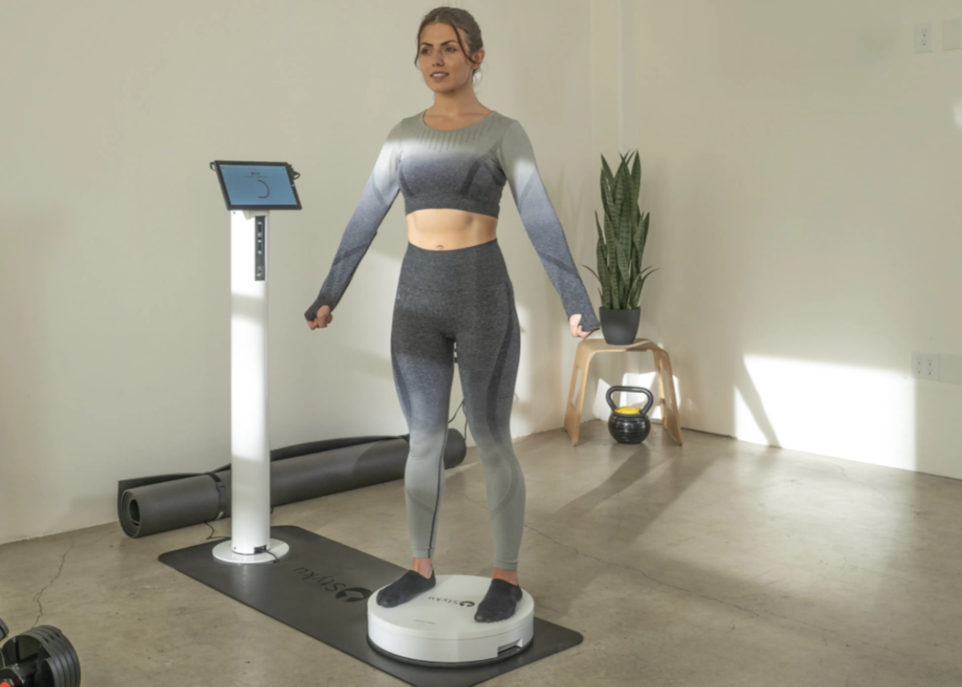 A woman getting a 3D body scanner done