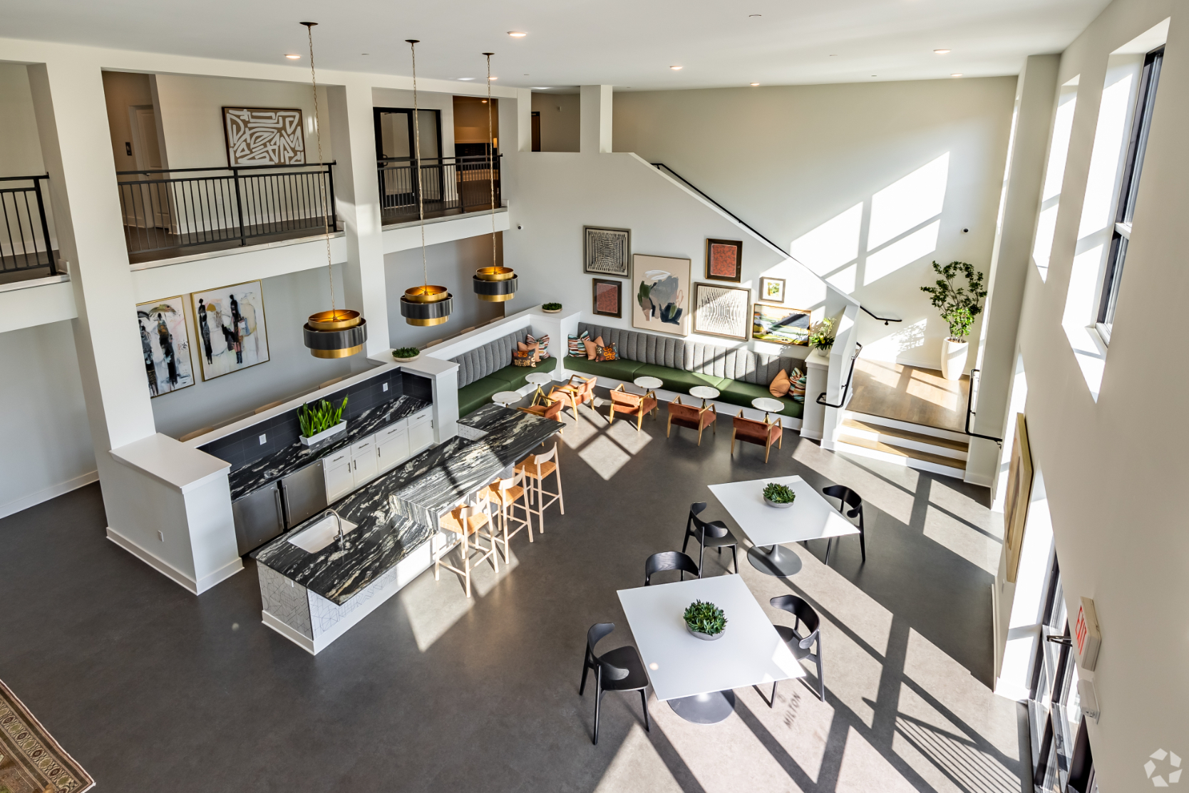Community clubhouse with kitchen and ables with chairs