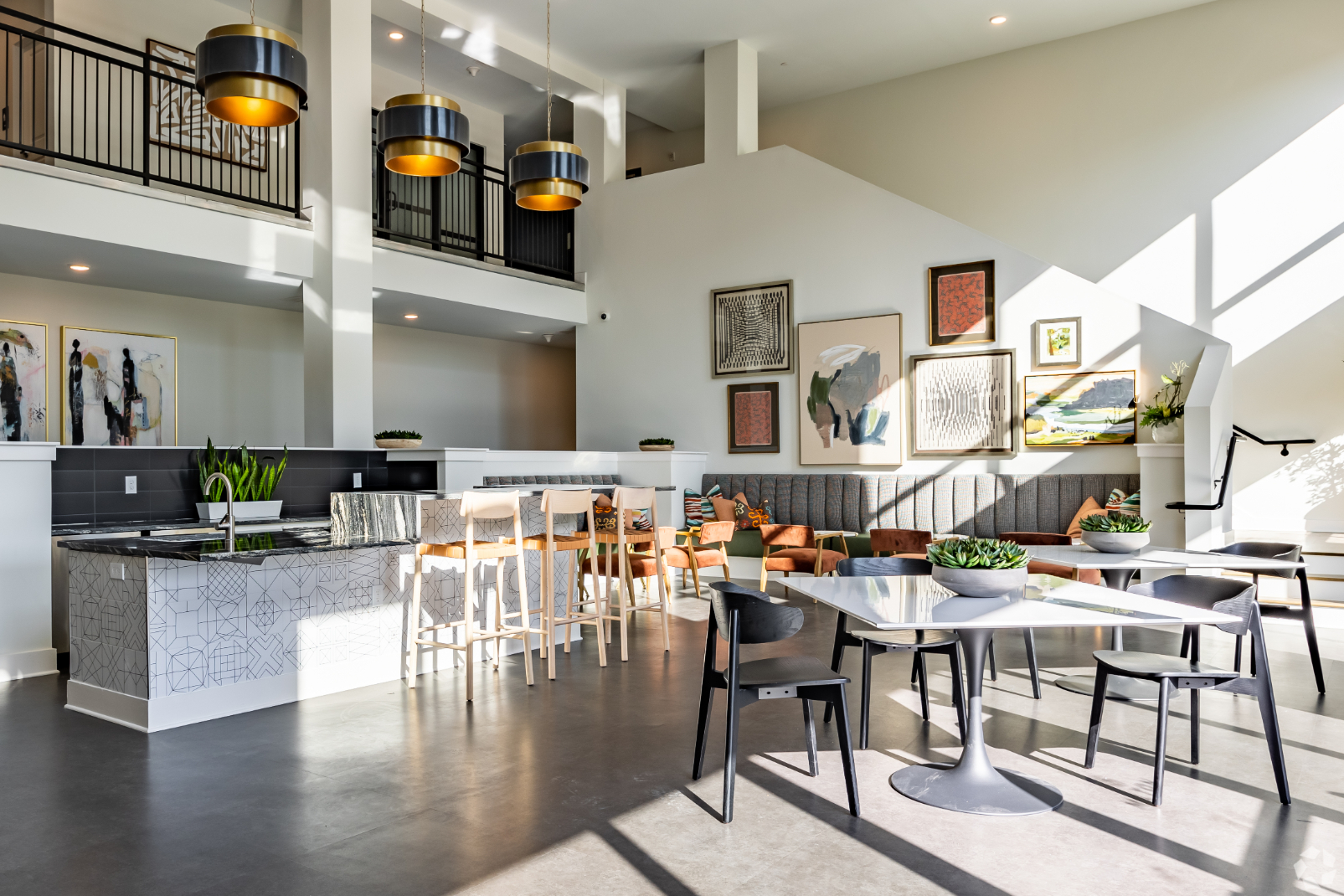 Community clubhouse with kitchen and ables with chairs