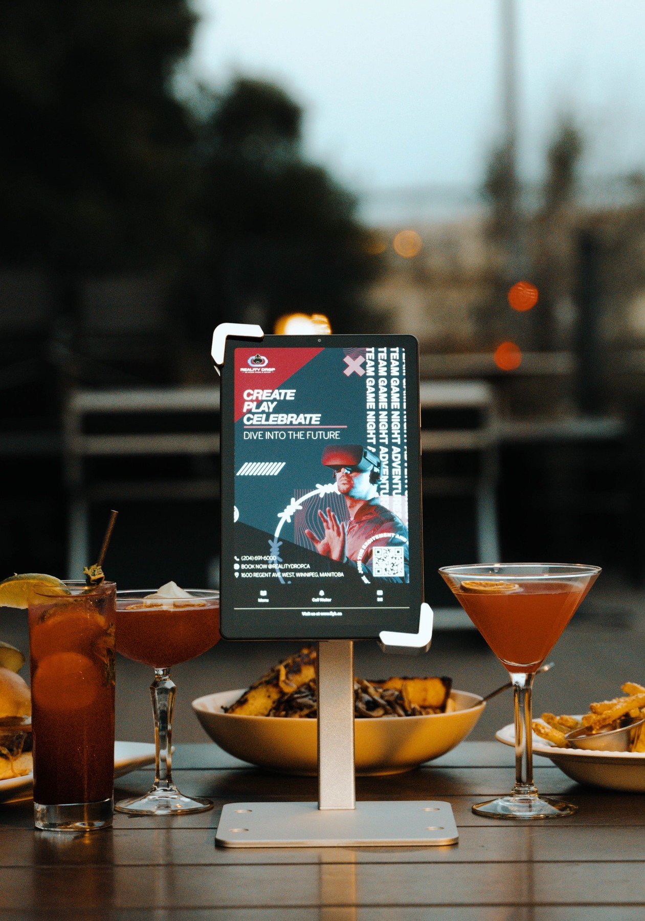 Flyk in-restaurant digital advertising tablet displaying a dynamic local ad on a restaurant table.