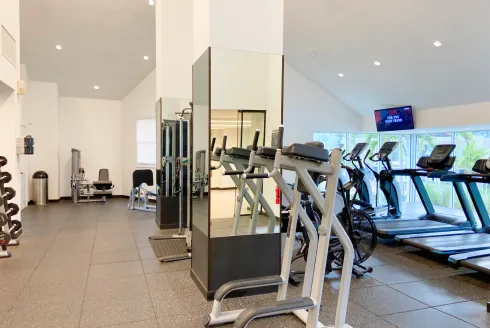 Accessible fitness center with cardio machines and weight equipment, Monte Carlo Miami