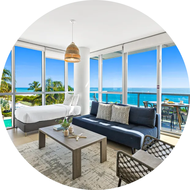 Furnished oceanfront living room and bedroom, Dharma Home Suites