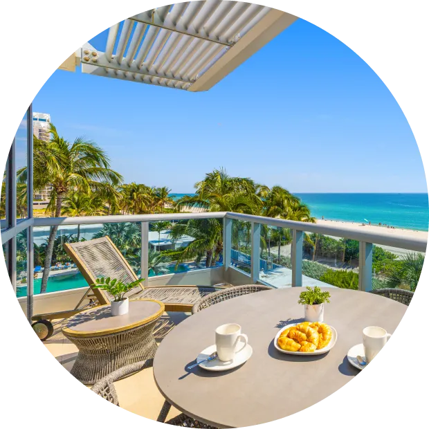 Oceanfront balcony breakfast setup, Dharma Home Suites