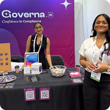 Governa AI representatives staffing a conference booth.