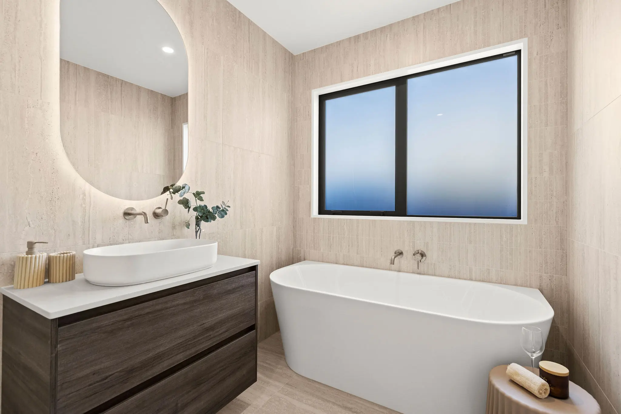 Tiled bathroom with freestanding bath