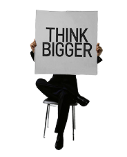 a man in black holding a journal with the text on it "think bigger"