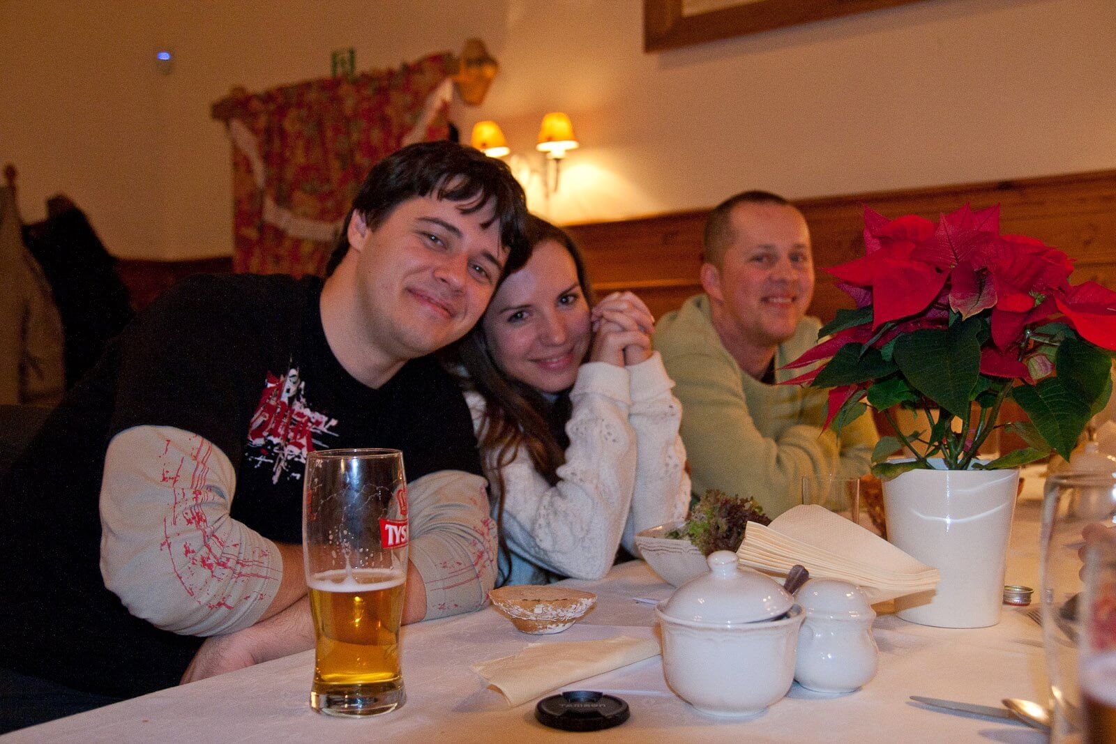 Xfive team members sitting behind the table and having a good time