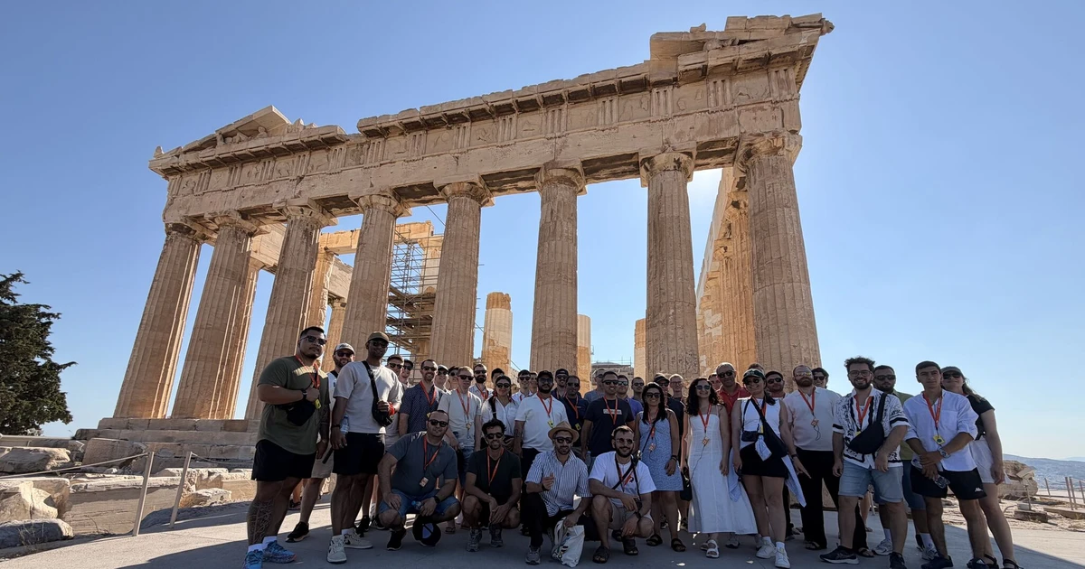 The Softr team posing in front of the Parthenon on the Acropolis in Athens