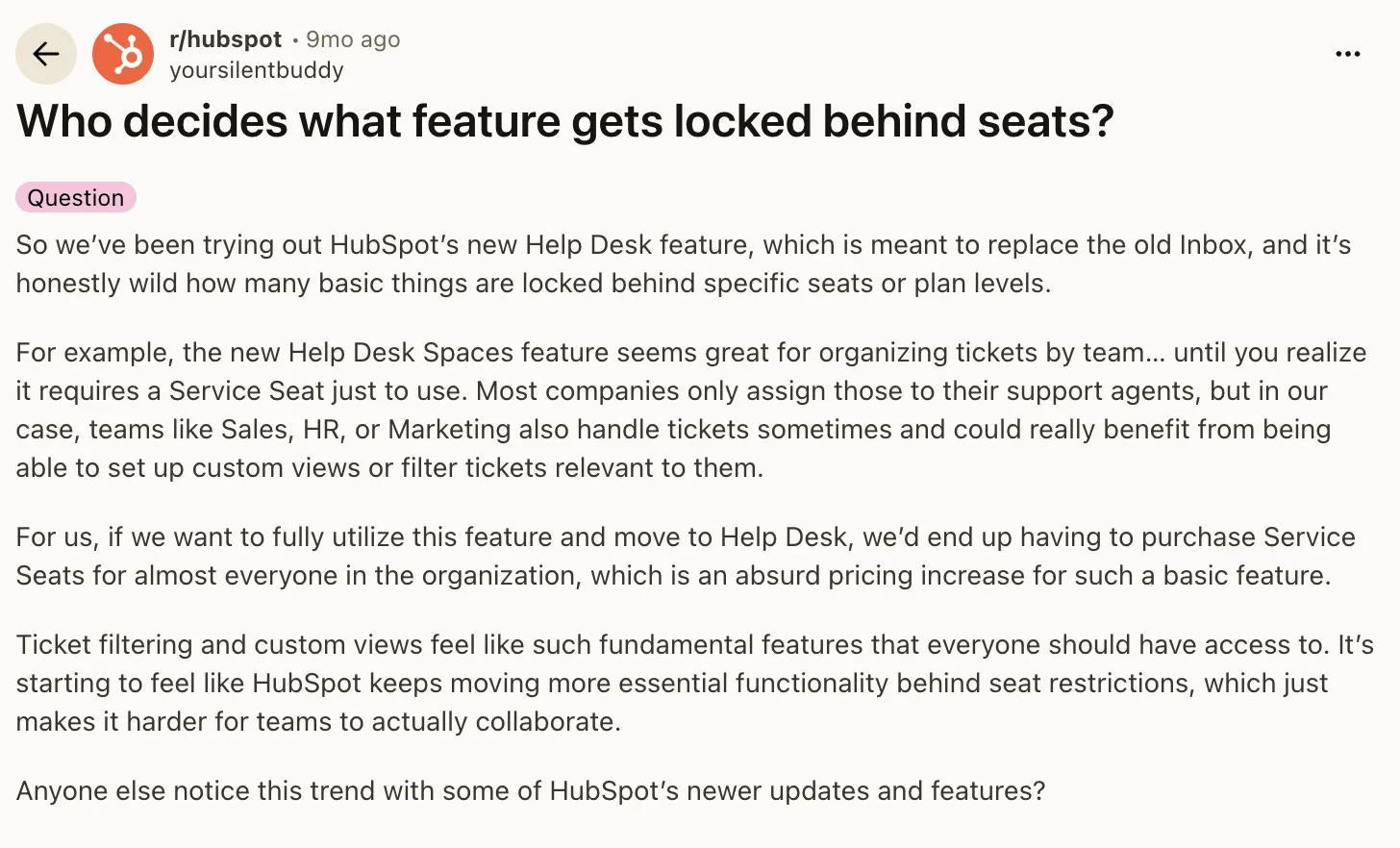 Reddit post in r/hubspot titled "Who decides what feature gets locked behind seats?" describing how Help Desk Spaces requires a Service Seat for everyone who touches tickets