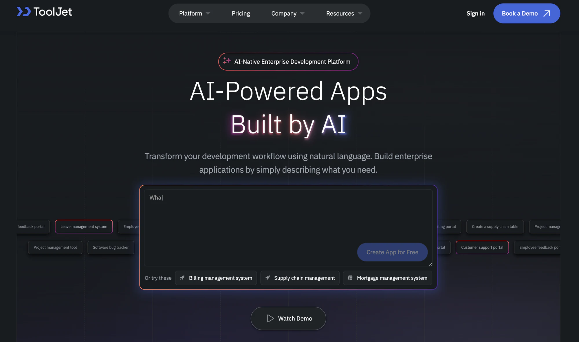 ToolJet homepage with an AI prompt box for describing an enterprise app and sample app suggestions