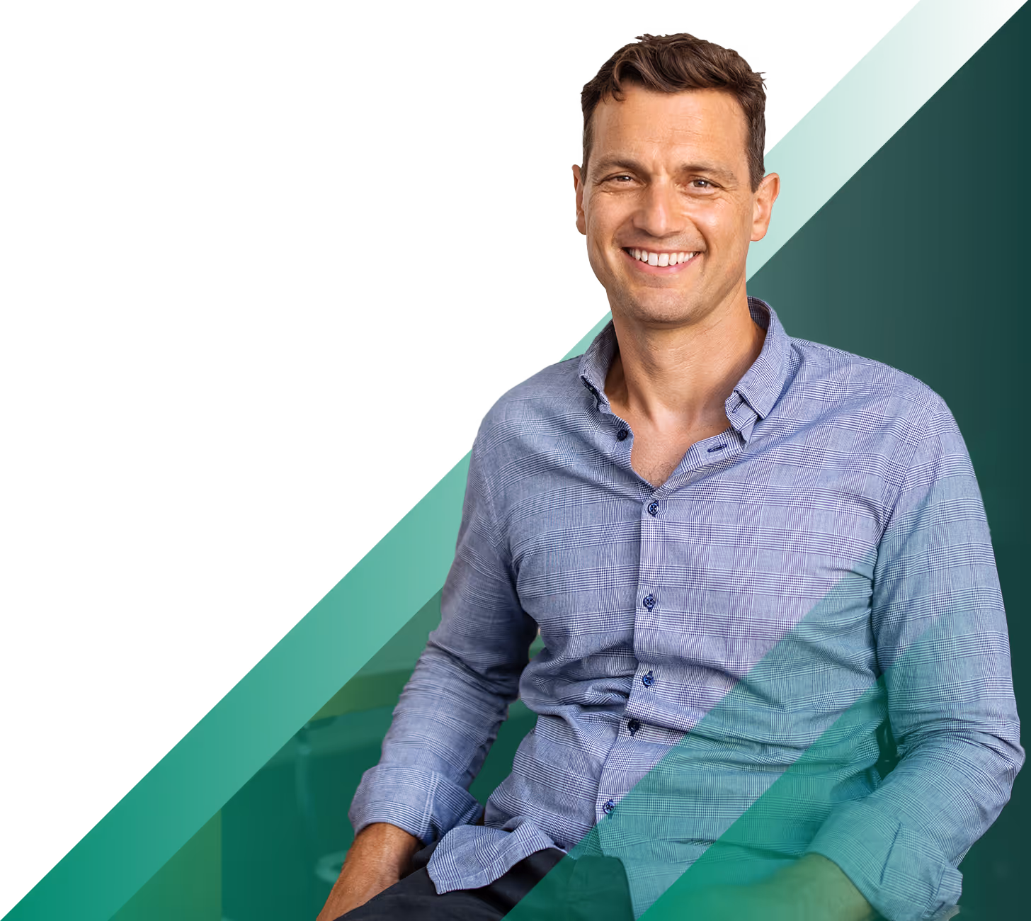a casual executive seated in a conference room, smiling for the camera