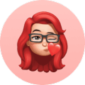 Red-haired woman with glasses and neutral expression