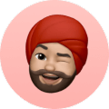 Man with red turban winking and tongue out