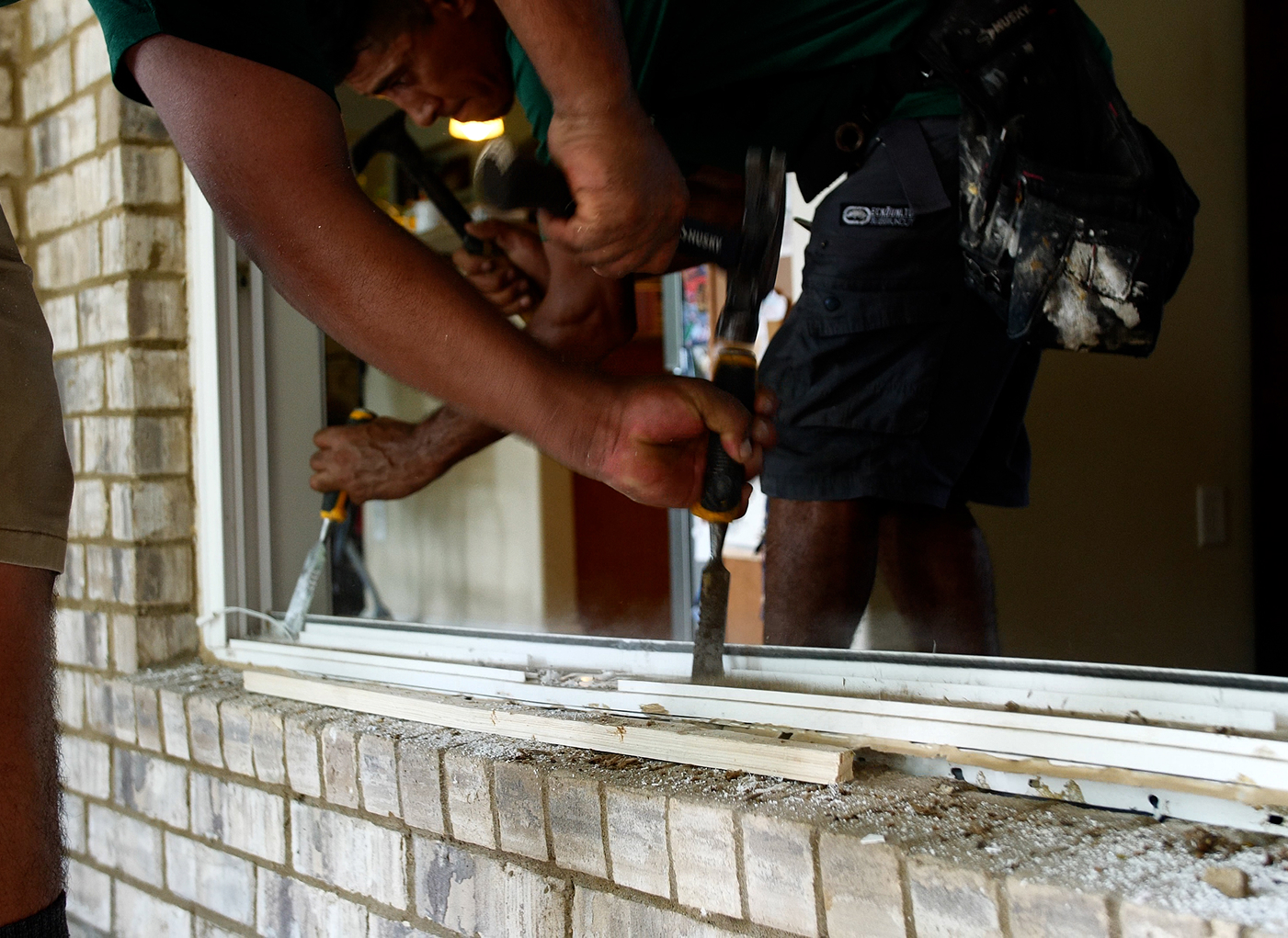 Two installers from the Window Source of Nashville installing a window