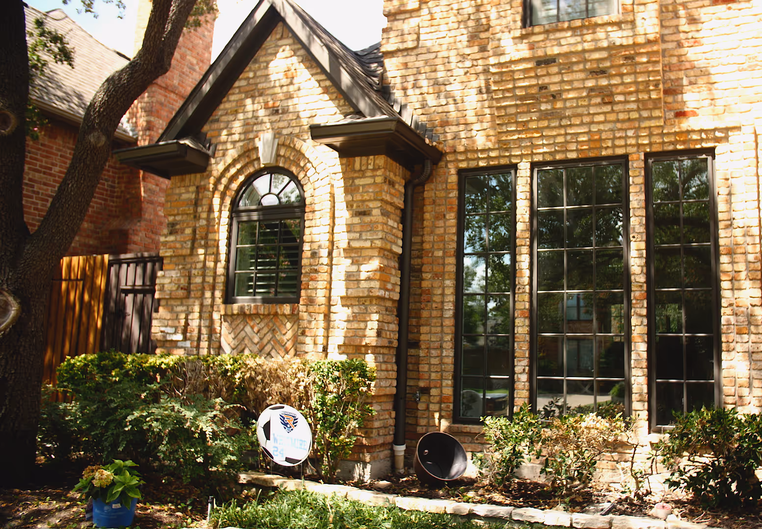 A brick house with black framed windows replaced by the Window Source of Nashville in Brentwood, TN