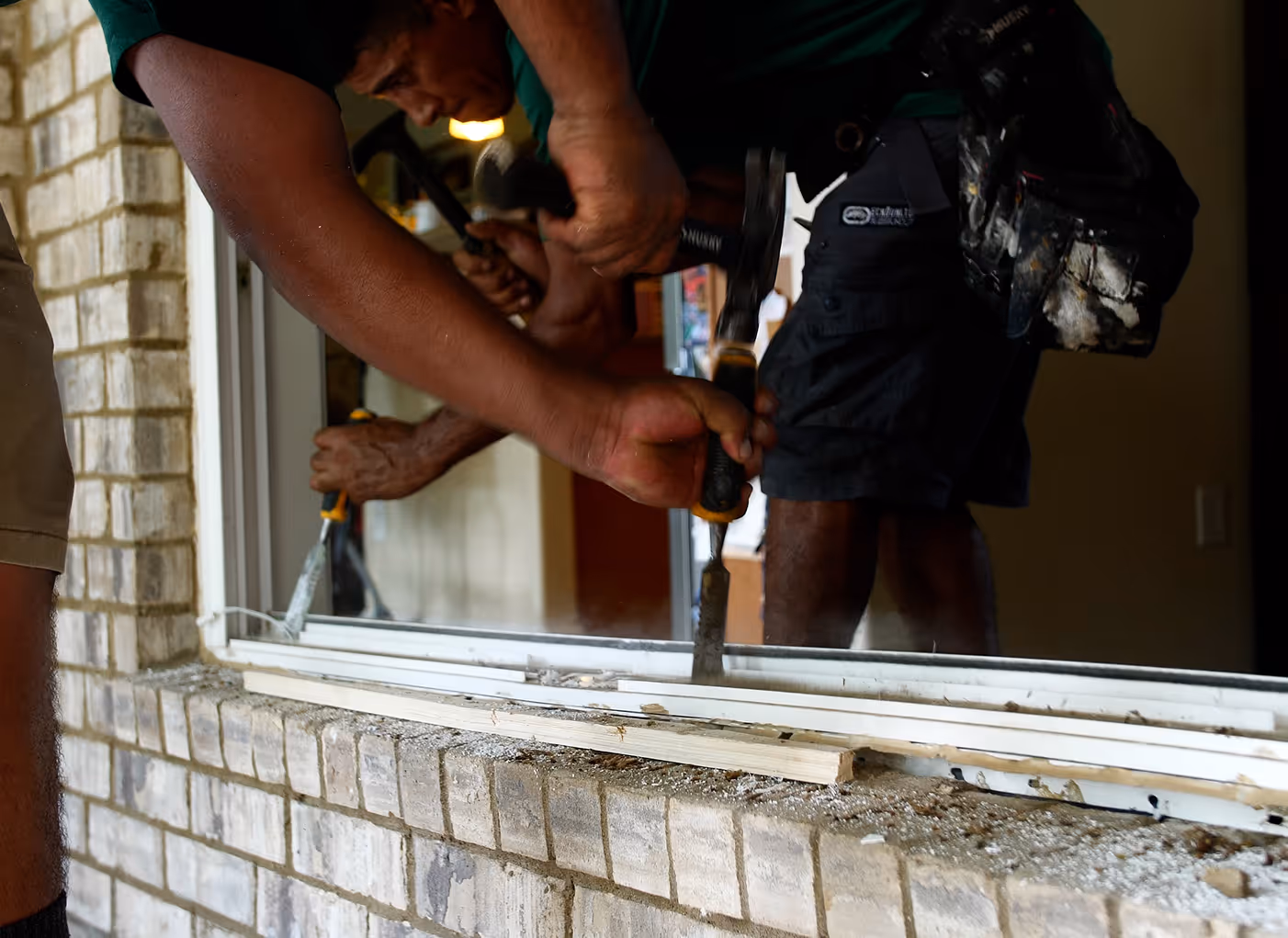 Two installers from the Window Source of Nashville installing a window in Franklin, TN
