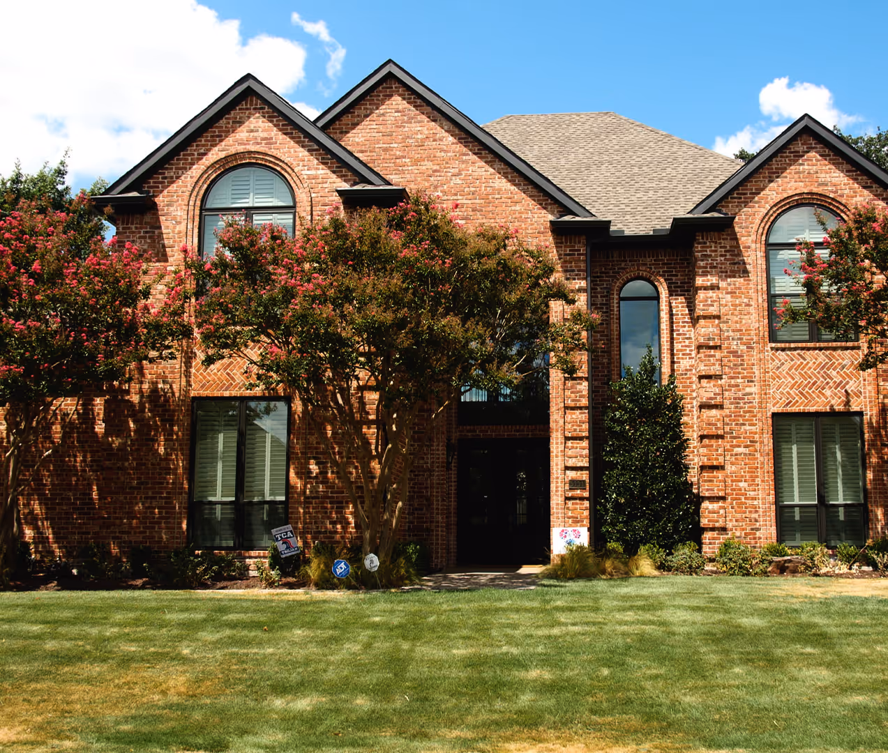A brick house with a new replacement door from The Window Source of Nashville in Murfreesboro, TN