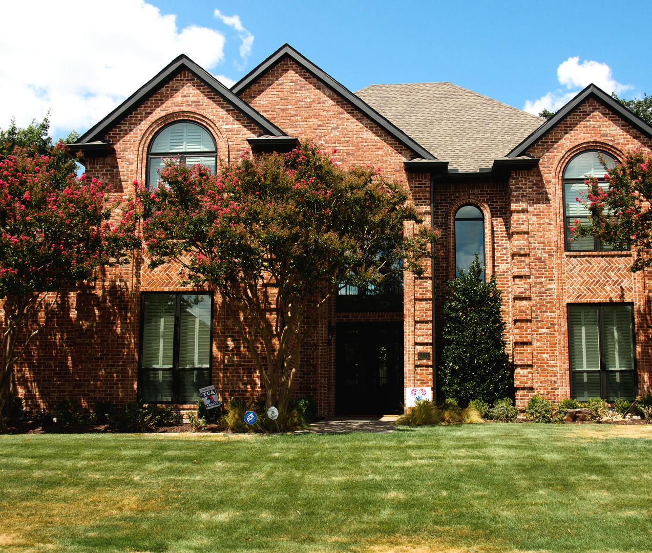 A brick house with a new replacement door from The Window Source of Nashville in Murfreesboro, TN