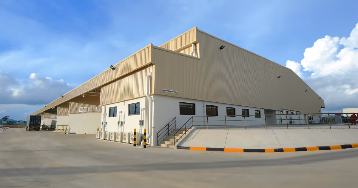 view of a factory from outside on a sunny day